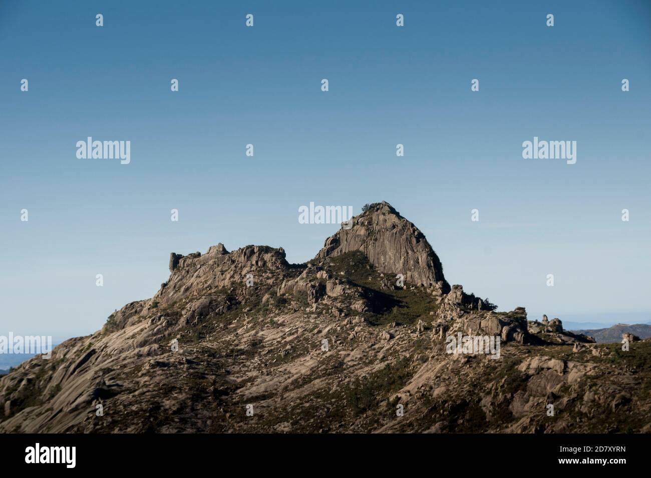 Rocky mountain peak at a mountain ridge under a clear blue sky Stock ...