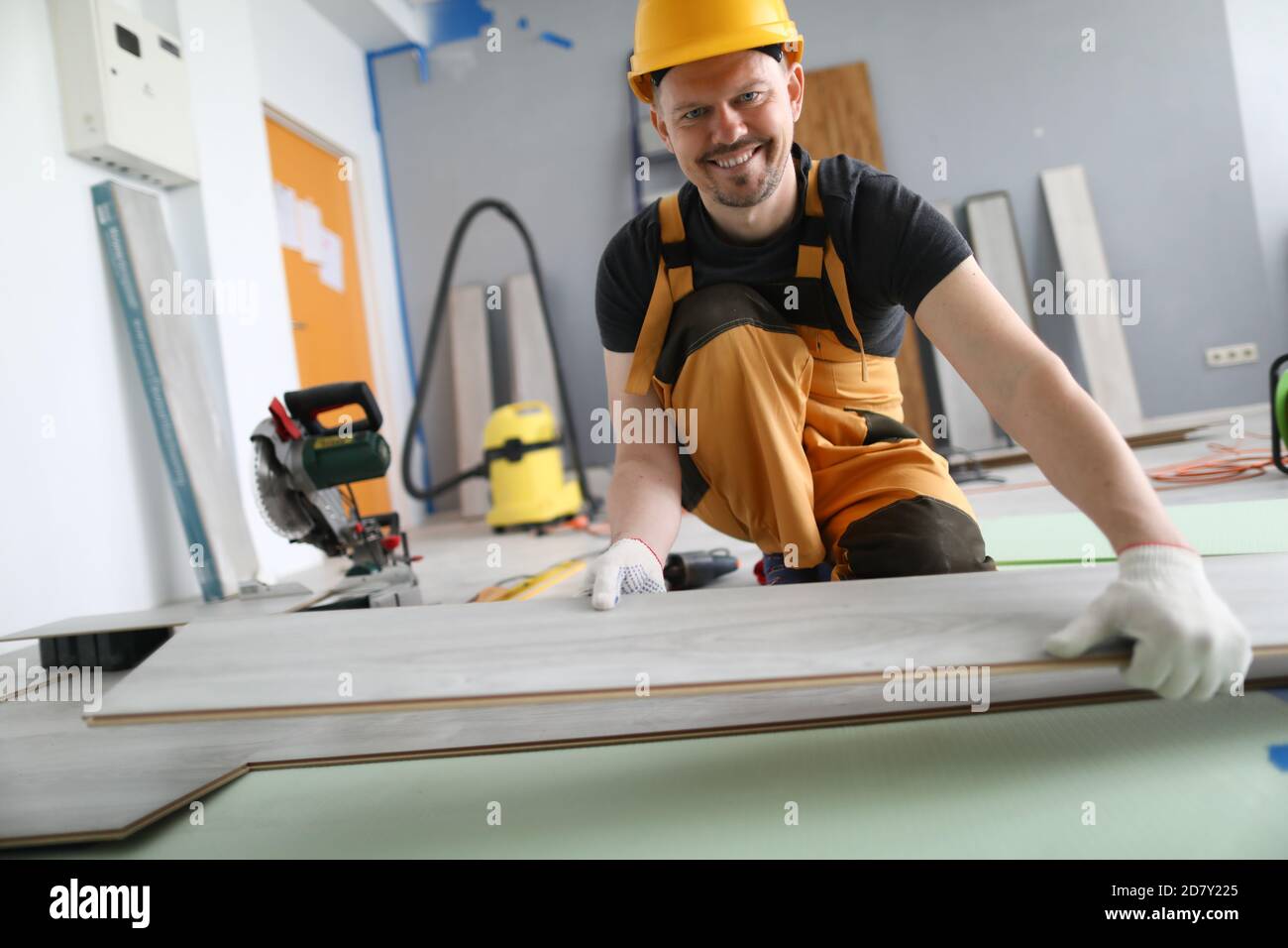 Man builder holds laminate board in his hands Stock Photo