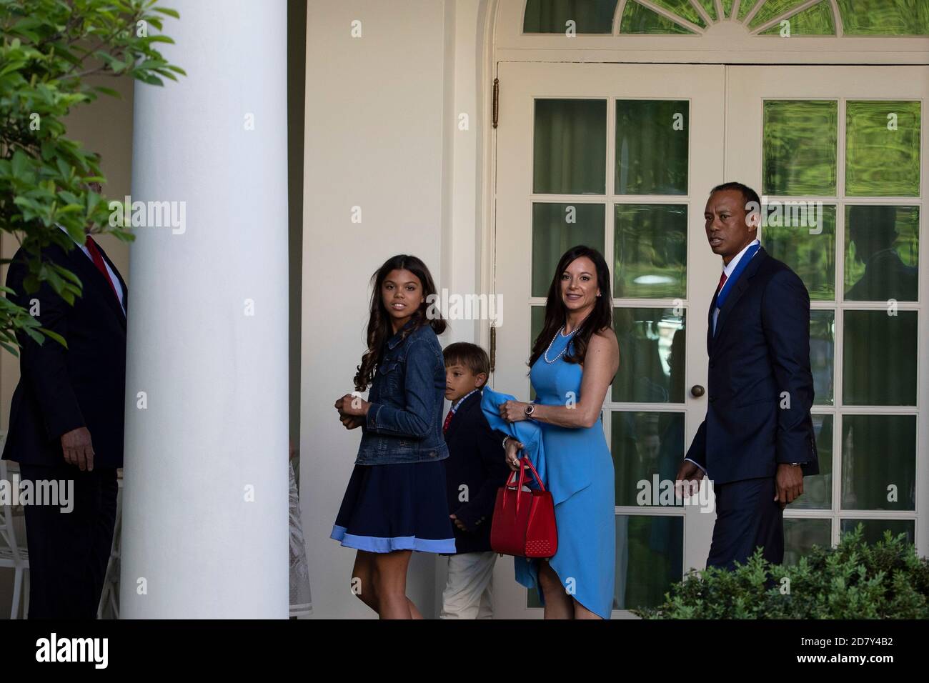 Golfer Tiger Woods accompanied by his children and girlfriend Erica Herman, follow U.S. President Donald Trump into the Oval Office after Trump awarded the Presidential Medal of Freedom to Woods in the Rose Garden of the White House in Washington, D.C. on Monday, May 6, 2019. The Presidential Medal of Freedom is the highest honor a U.S. President can bestow on a civilian. Woods is the fourth golfer to receive the award. Credit: Alex Edelman/The Photo Access Stock Photo