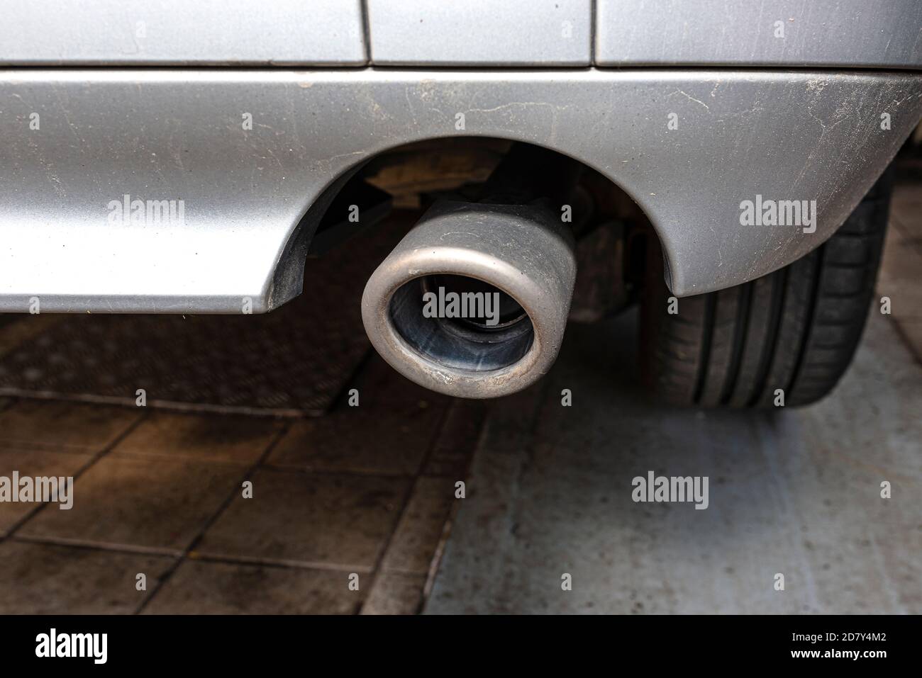 The exhaust system in the diesel car seen up close, view from rear of muffler. Stock Photo