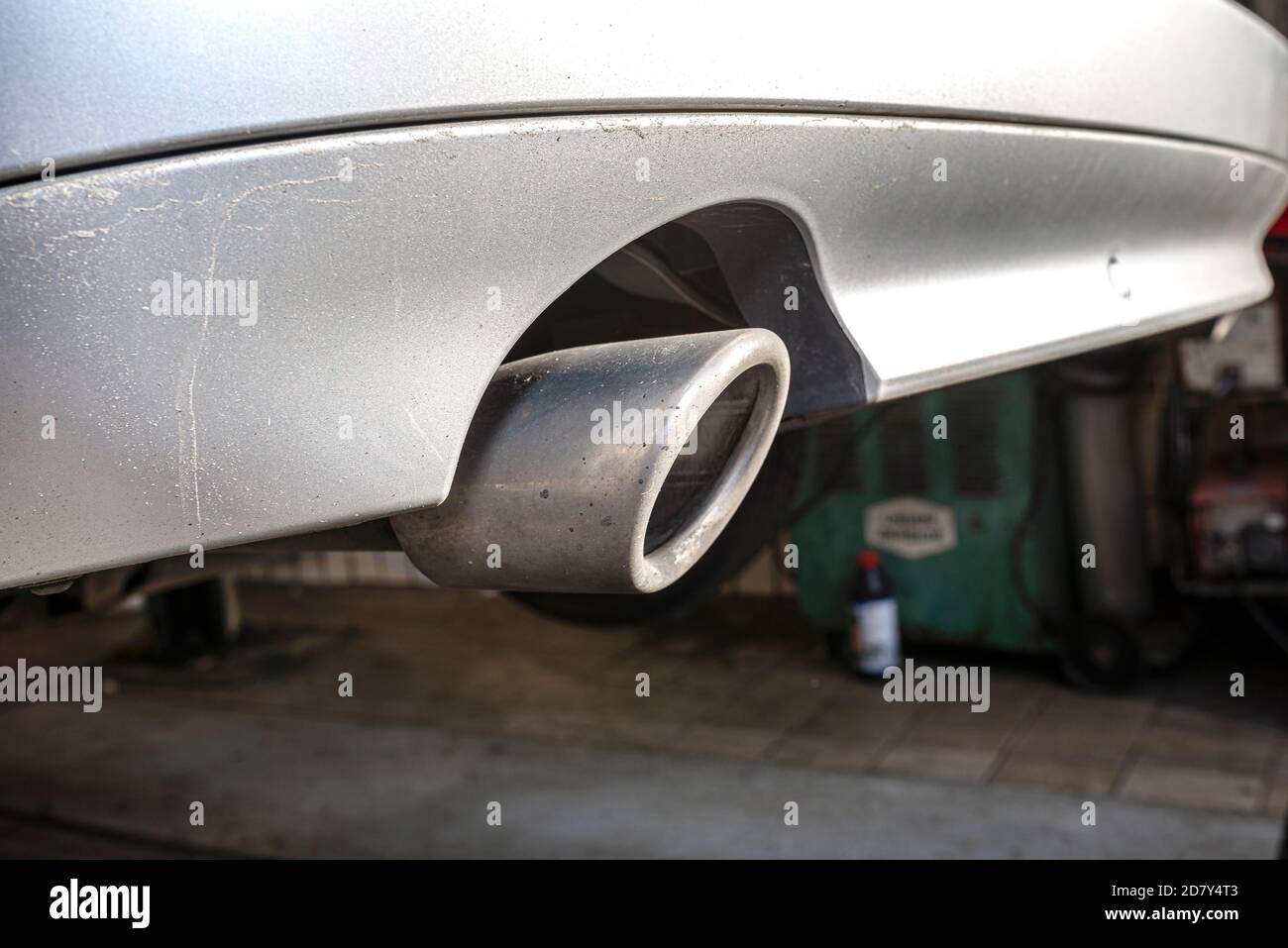 The exhaust system in the diesel car seen up close, view from rear of