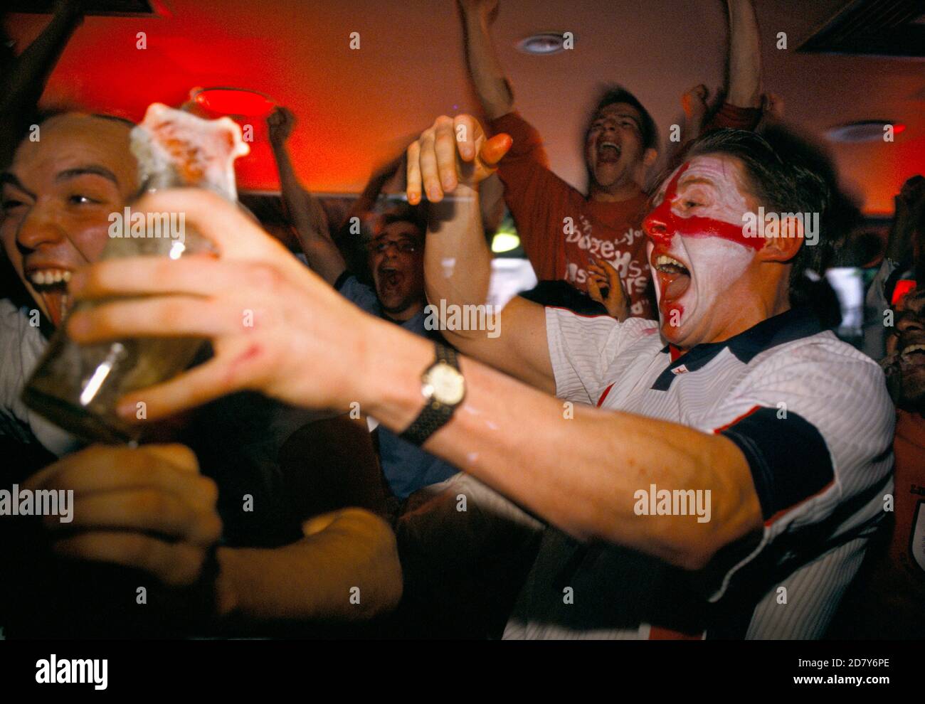 UK football fans World Cup 1998. Supporters watching a penalty shoot out between England and Argentina that decided the game, Argentina won 4–3 after two English kicks were saved. England was  knocked out of the World Cup. Watching on a multi screens in a television room of the Sports Bar, London 1990s UK HOMER SYKES Stock Photo
