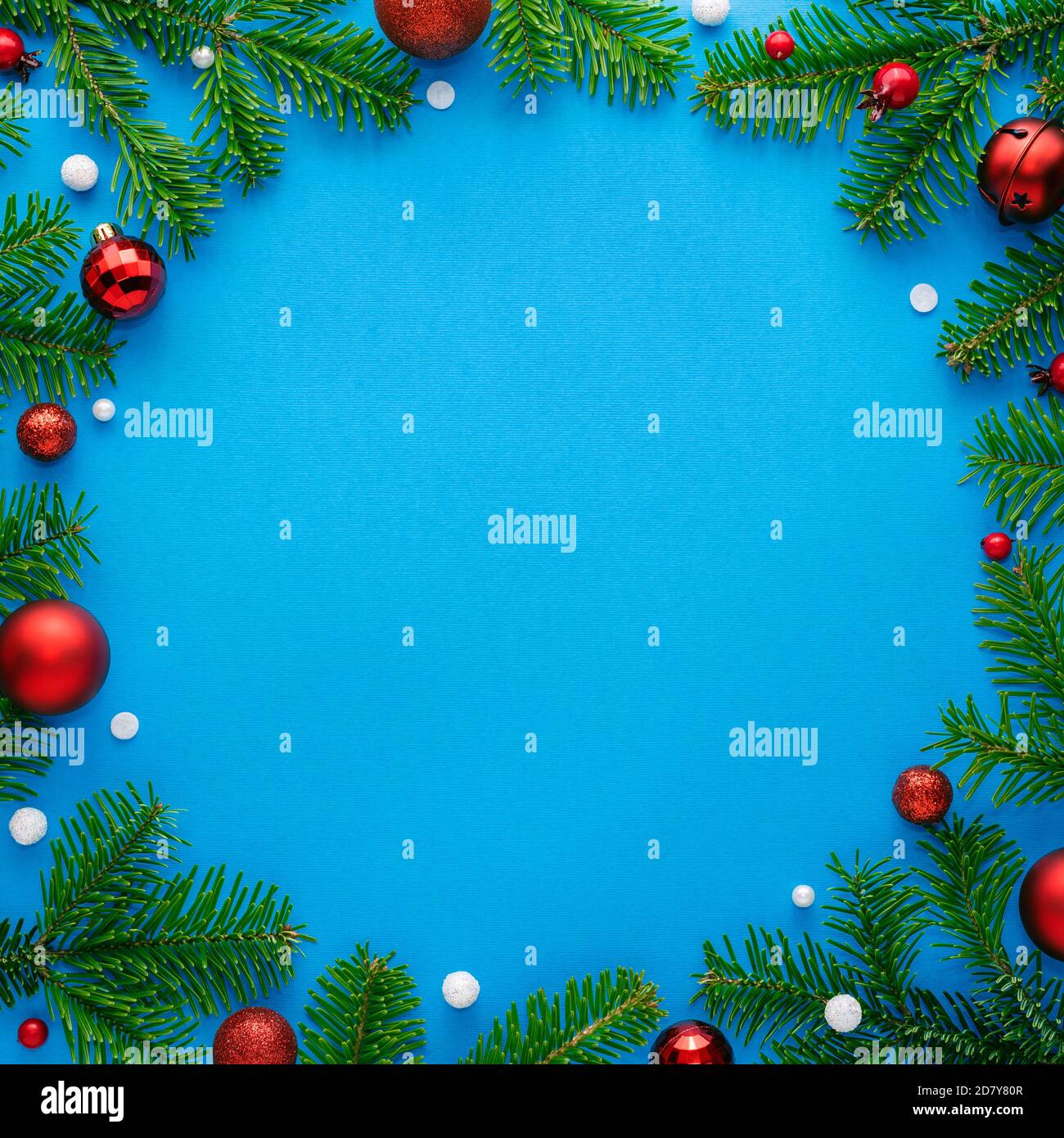 Blue christmas card with round frame decorated with festive ornaments. Copy space for festive text. Top view Stock Photo
