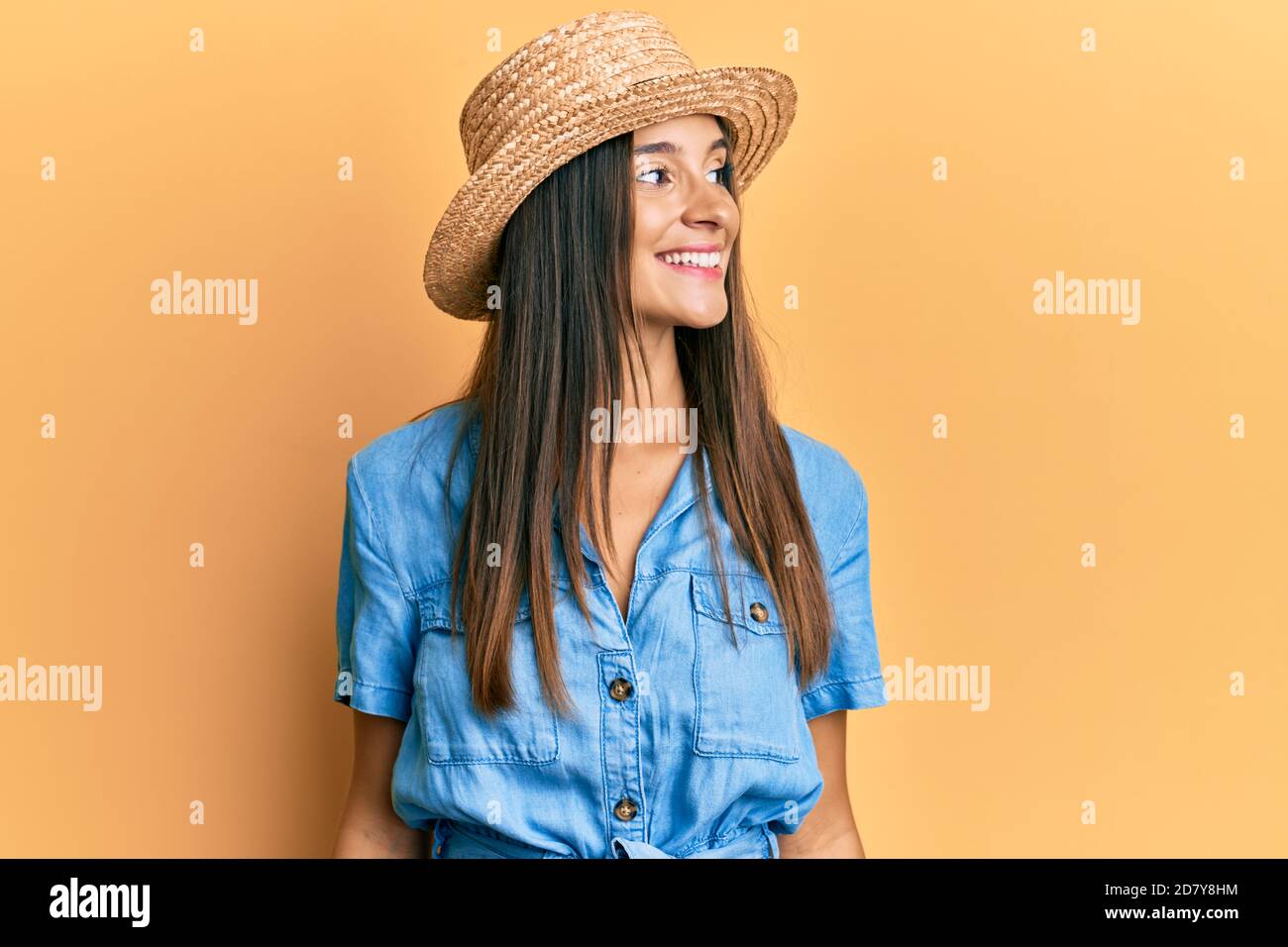 Hispanic Poses Young hispanic woman wearing summer hat looking to side, relax profile ...