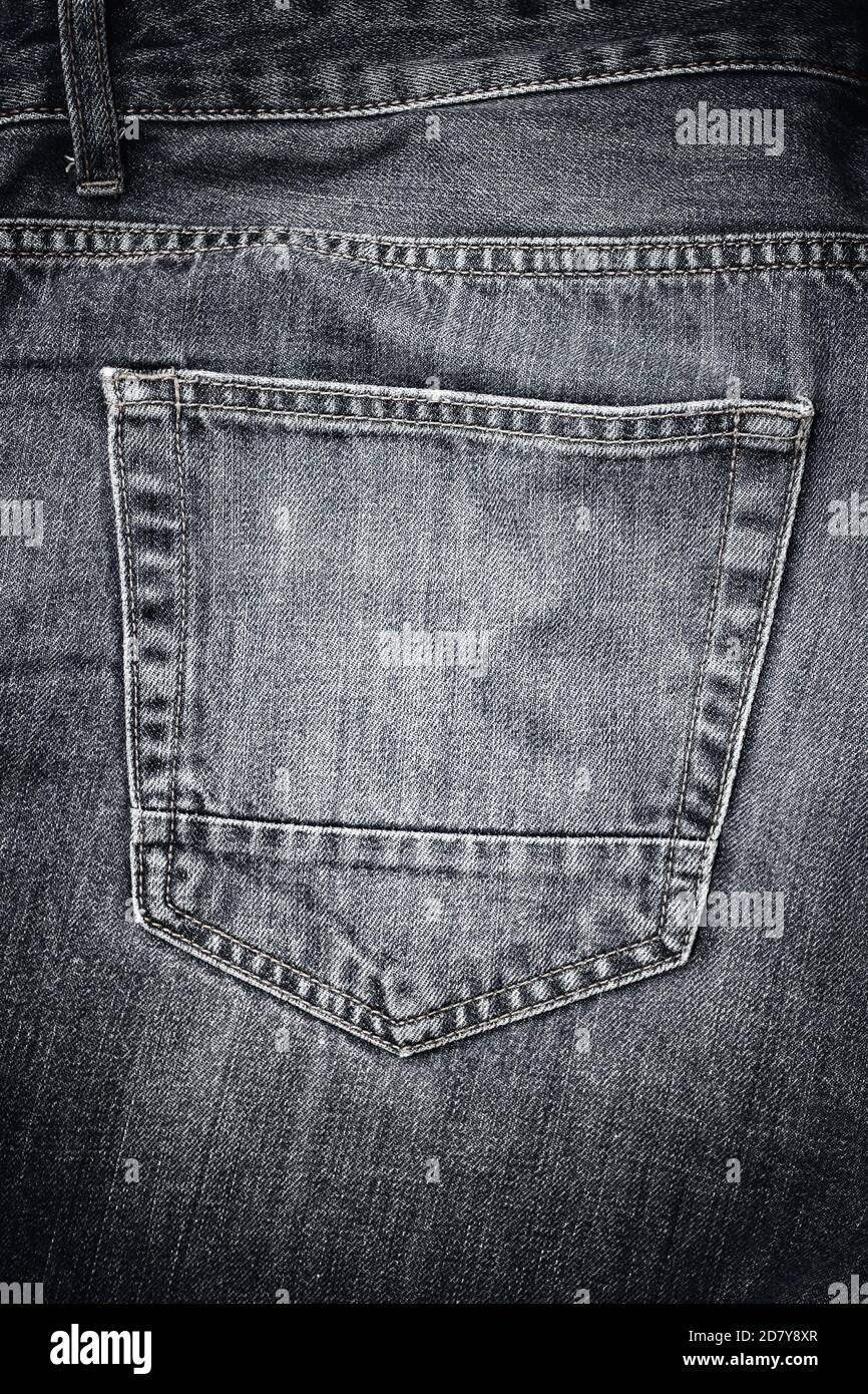Back pocket on old worn jeans Stock Photo