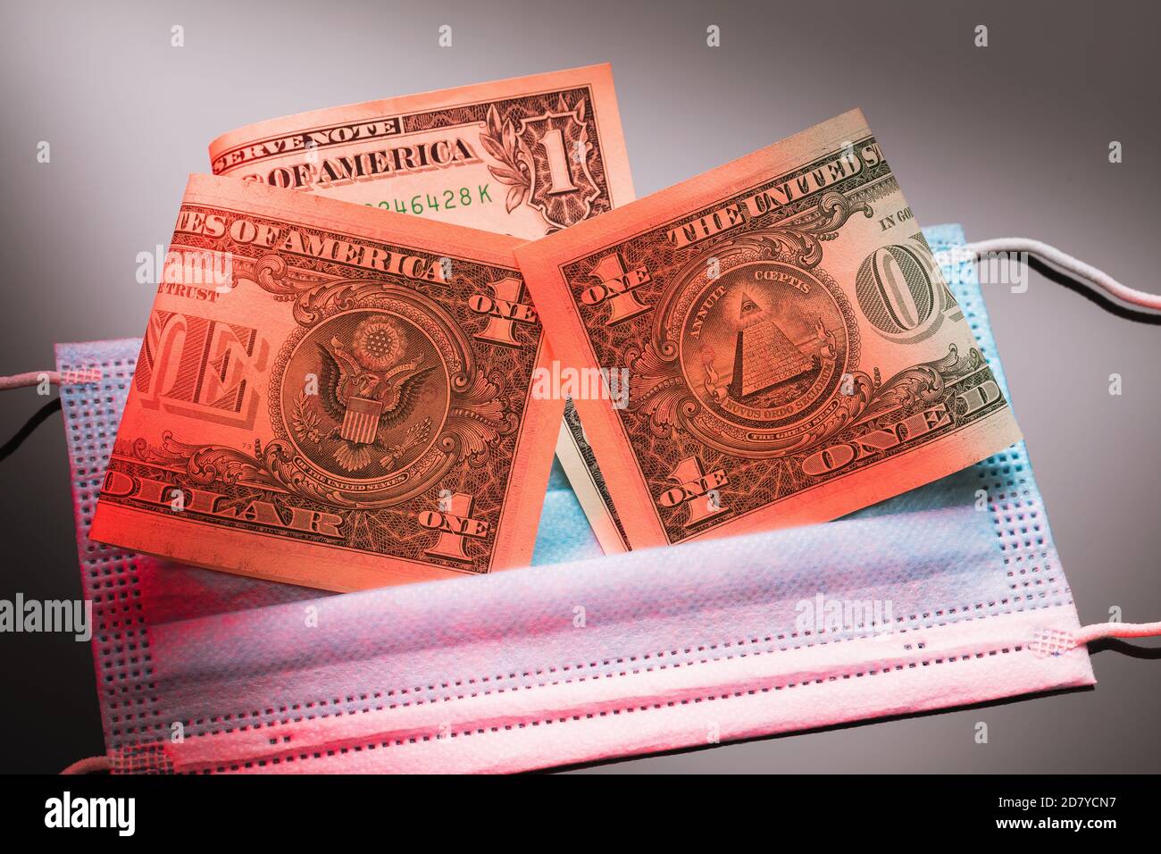 Dollars on a medical disposable mask on a gradient background. Concept