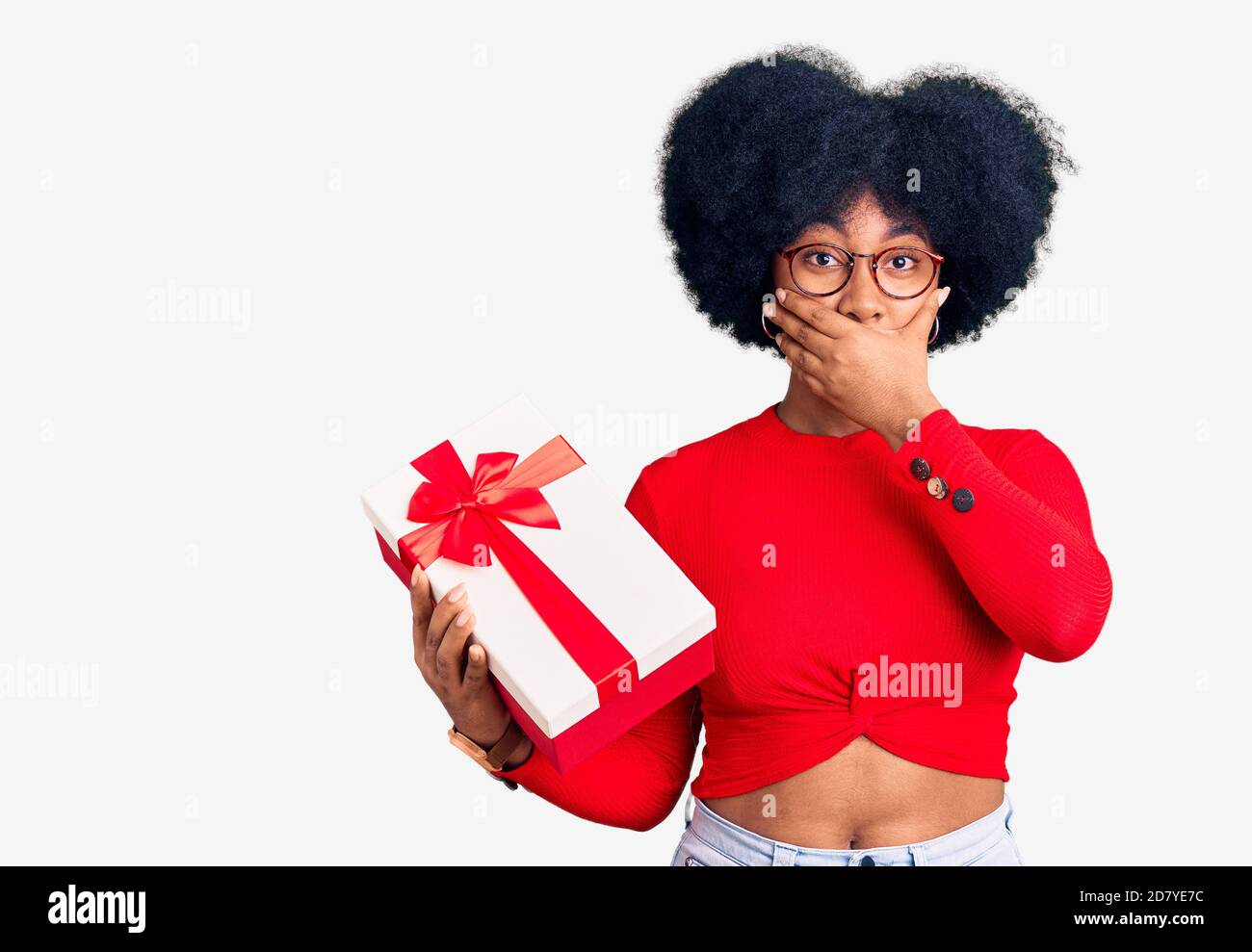 https://c8.alamy.com/comp/2D7YE7C/young-african-american-girl-holding-gift-shocked-covering-mouth-with-hands-for-mistake-secret-concept-2D7YE7C.jpg
