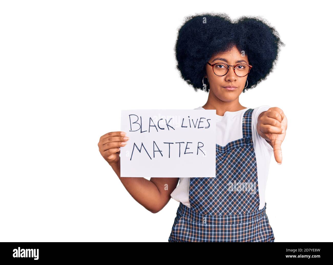 Young african american girl holding black lives matter banner with angry face, negative sign showing dislike with thumbs down, rejection concept Stock Photo