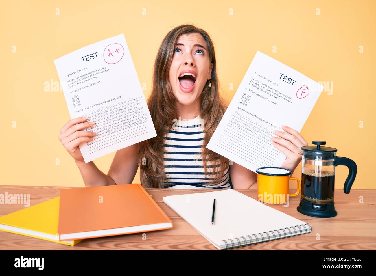 Young beautiful caucasian woman showing failed and passed exam sitting ...