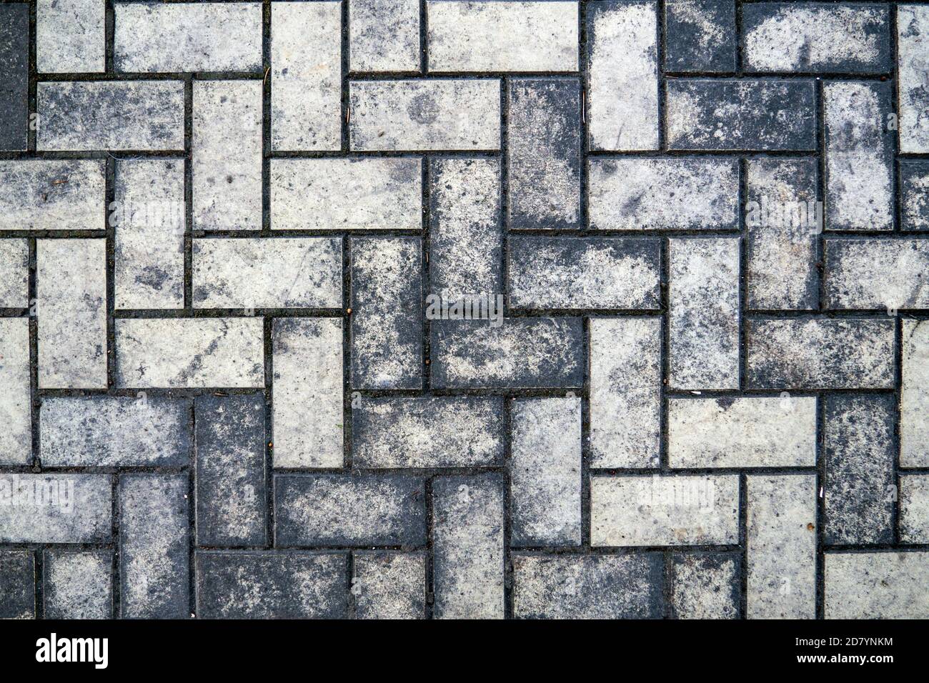 Top view of a dirty gray brick pavement Stock Photo