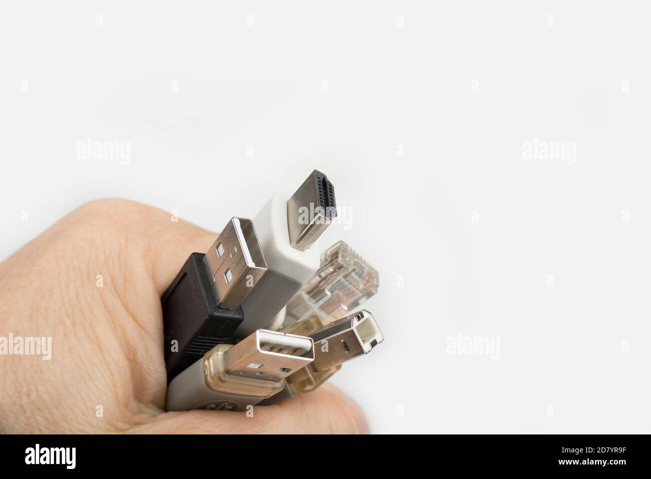 Computer cables in the hand on a white Stock Photo