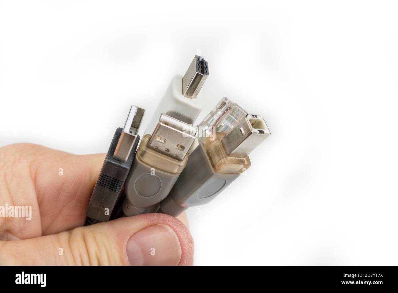 Computer cables in the hand on a white Stock Photo