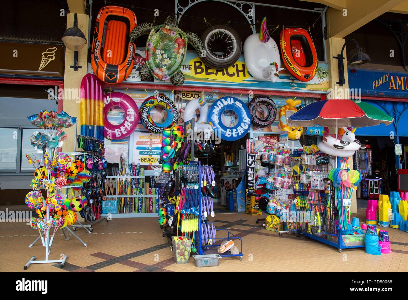 Beach shop selling toys, nets, rubber rings, etc. on the front at Barry Island, Glamorgan, South Wales. Stock Photo