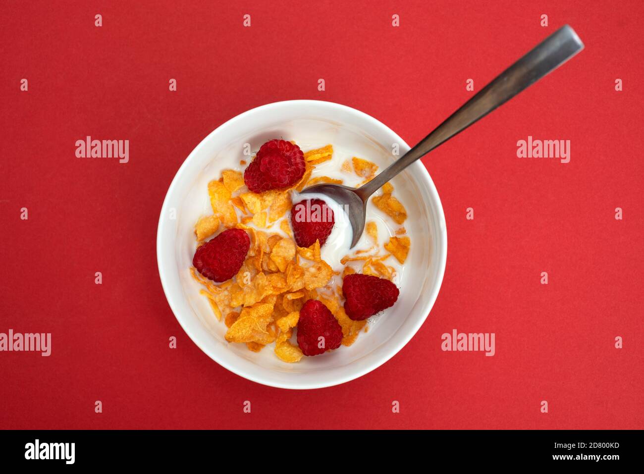 Cornflakes with fresh raspberries Stock Photo