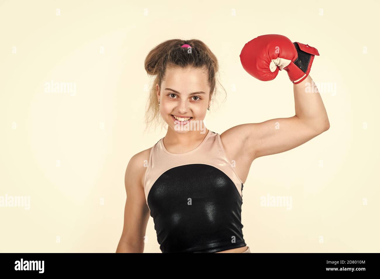 be strong. sport and fitness. teen girl boxer. sportswear and equipment  shop. healthy lifestyle. energetic kids power. child workout in gym  isolated on white. small girl training in boxing gloves Stock Photo -