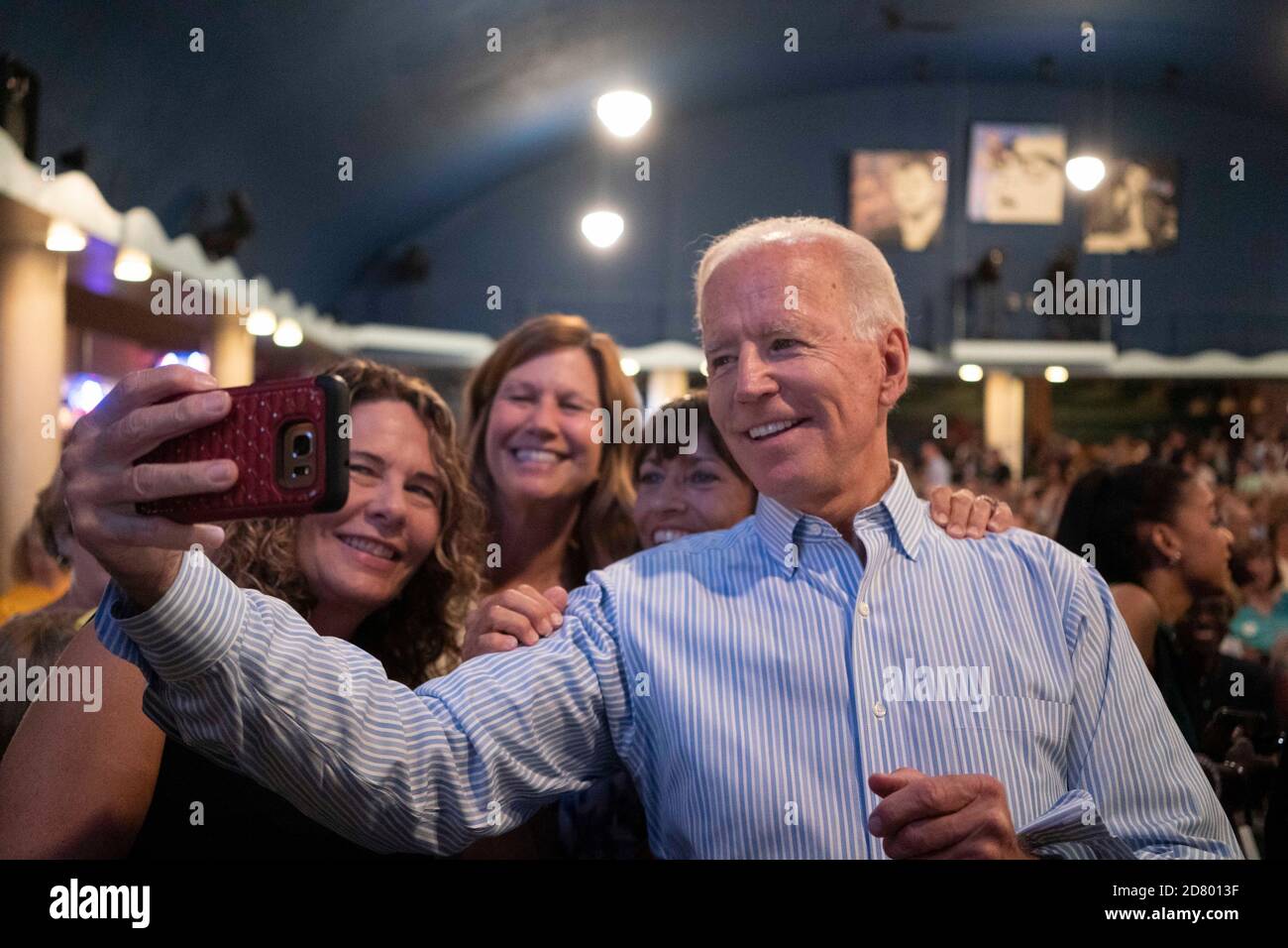 2020 Democratic presidential hopeful former Vice President Joe Biden takes a selfie with supporters at the Wing Ding Dinner on August 9, 2019 in Clear Lake, Iowa. The dinner has become a must attend for Democratic presidential hopefuls ahead of the of Iowa Caucus. Credit: Alex Edelman/The Photo Access Stock Photo