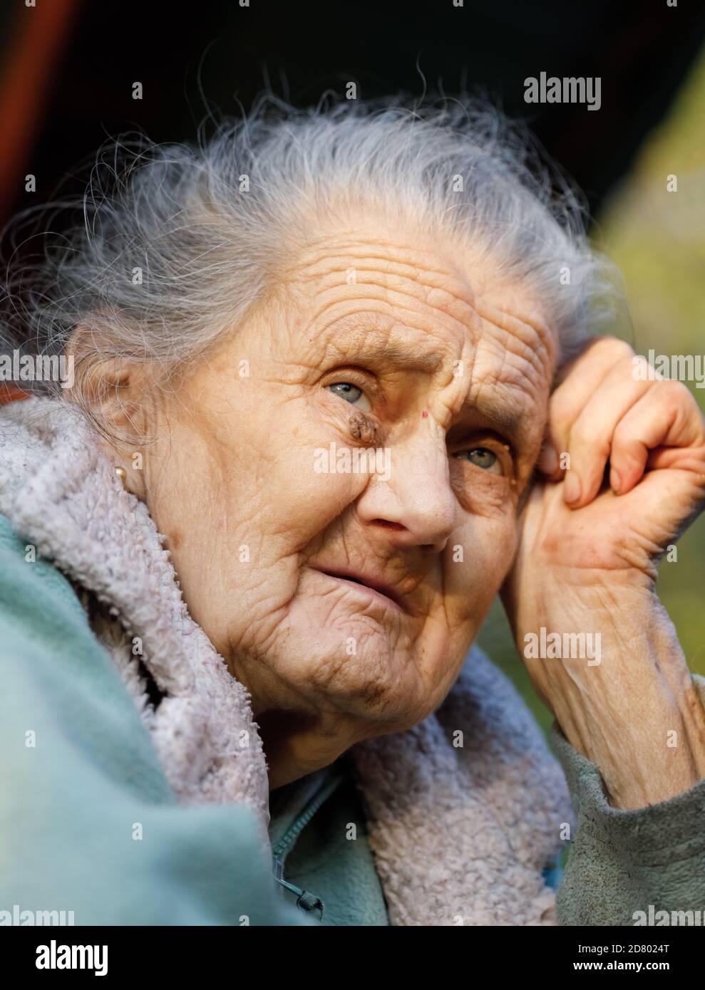 Old woman. Portrait of a very old and tired of life wrinkled woman ...