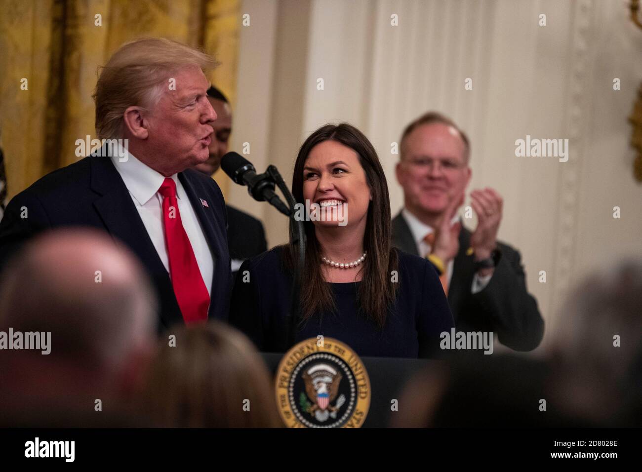 U.S. President Donald Trump speaks as he embraces outgoing White House Press Secretary Sarah Huckabee Sanders as delivers remarks about prison reform in the East Room of the White House in Washington, D.C. on June 13, 2019. Sanders announced today that she will be leaving the White House at the end of the month. Credit: Alex Edelman/The Photo Access Stock Photo