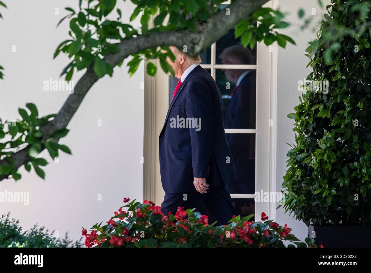 U.S. President Donald Trump exits the Oval Office before speaking with reporters on the South Lawn prior to departing the White House aboard Marine One on June 26, 2019 in Washington,D.C.. Trump will travel to Japan to attend the G-20 Summit. Credit: Alex Edelman/The Photo Access Stock Photo