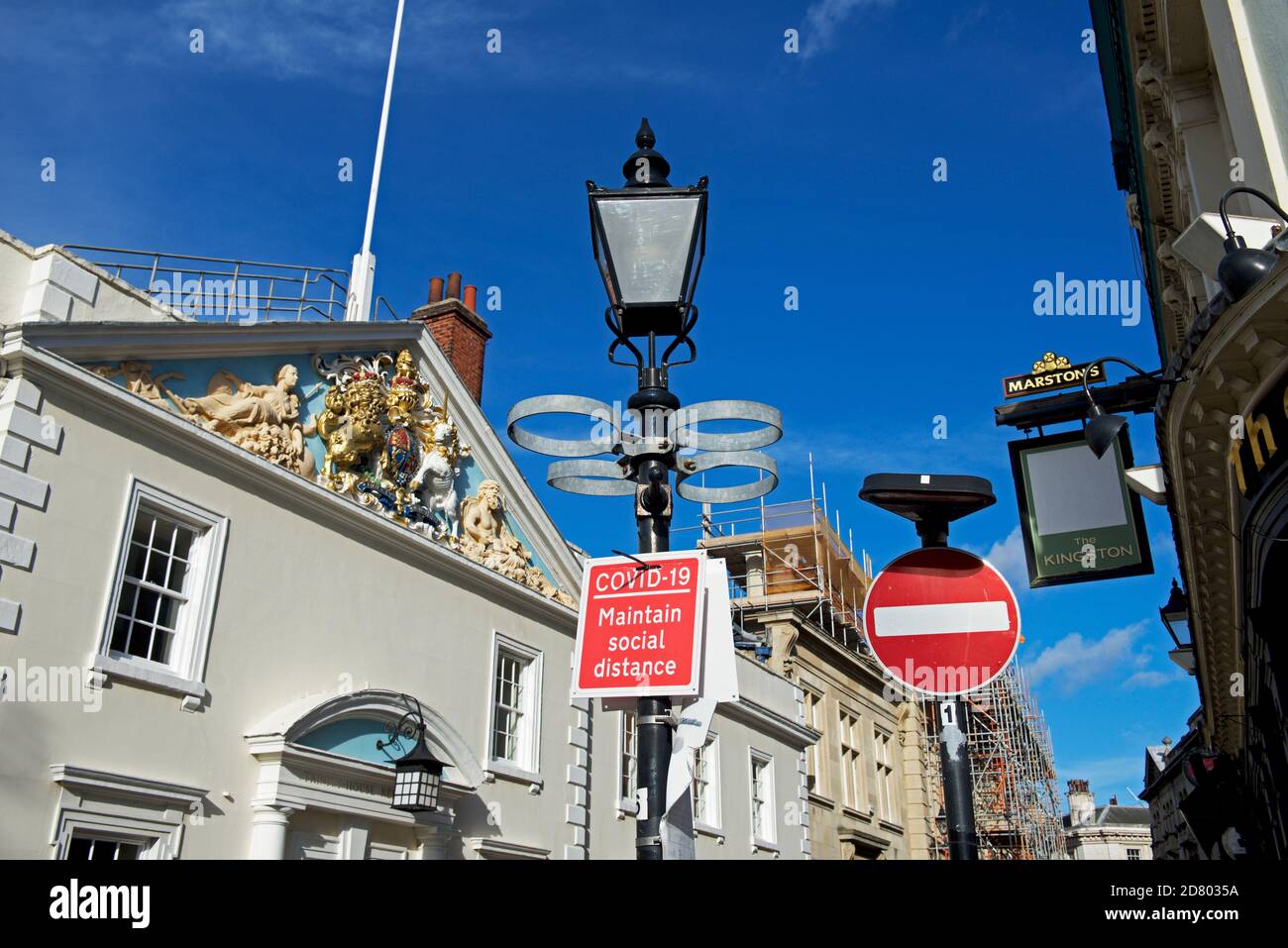 Sign - Covid-19, Maintain Social Distance - and Trinity house, Hull, East Yorkshire, Humberside, England UK Stock Photo