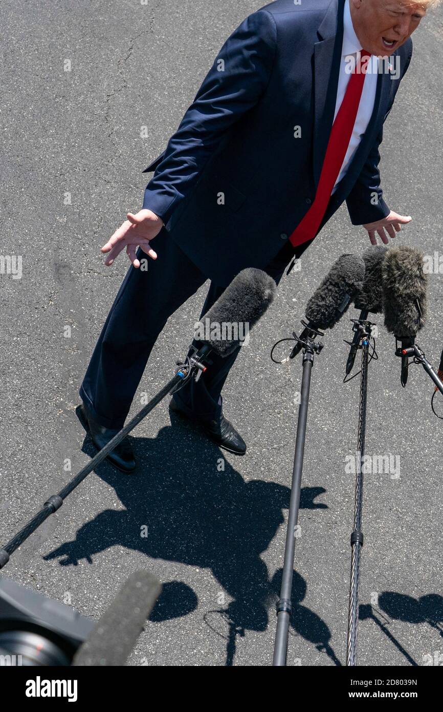 U.S. President Donald Trump speaks with reporters on the South Lawn prior to departing the White House aboard Marine One on June 26, 2019 in Washington,D.C.. Trump will travel to Japan to attend the G-20 Summit. Credit: Alex Edelman/The Photo Access Stock Photo