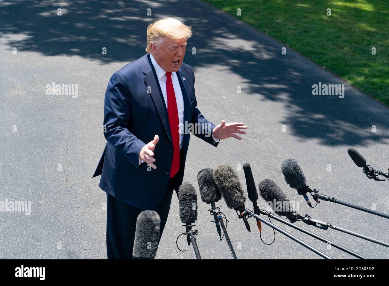 U.S. President Donald Trump speaks with reporters on the South Lawn prior to departing the White House aboard Marine One on June 26, 2019 in Washington,D.C.. Trump will travel to Japan to attend the G-20 Summit. Credit: Alex Edelman/The Photo Access Stock Photo