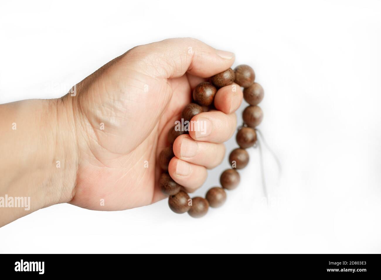 Close-up with rosary in hand Stock Photo
