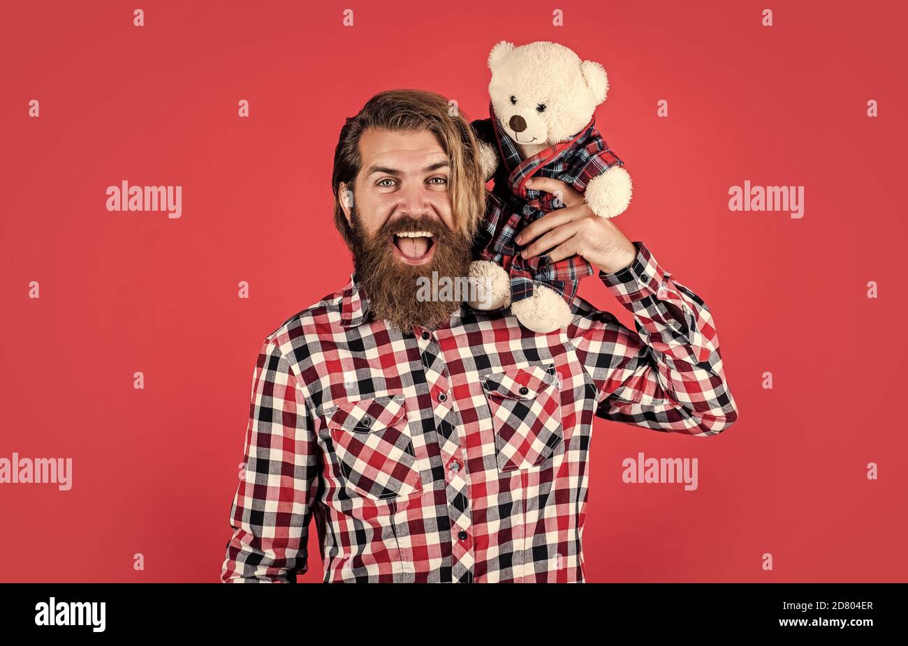 cheerful bearded man hold teddy bear. male feel playful with bear. brutal mature hipster man play with toy. happy birthday. being in good mood. happy valentines day. Valentines day sales. Stock Photo