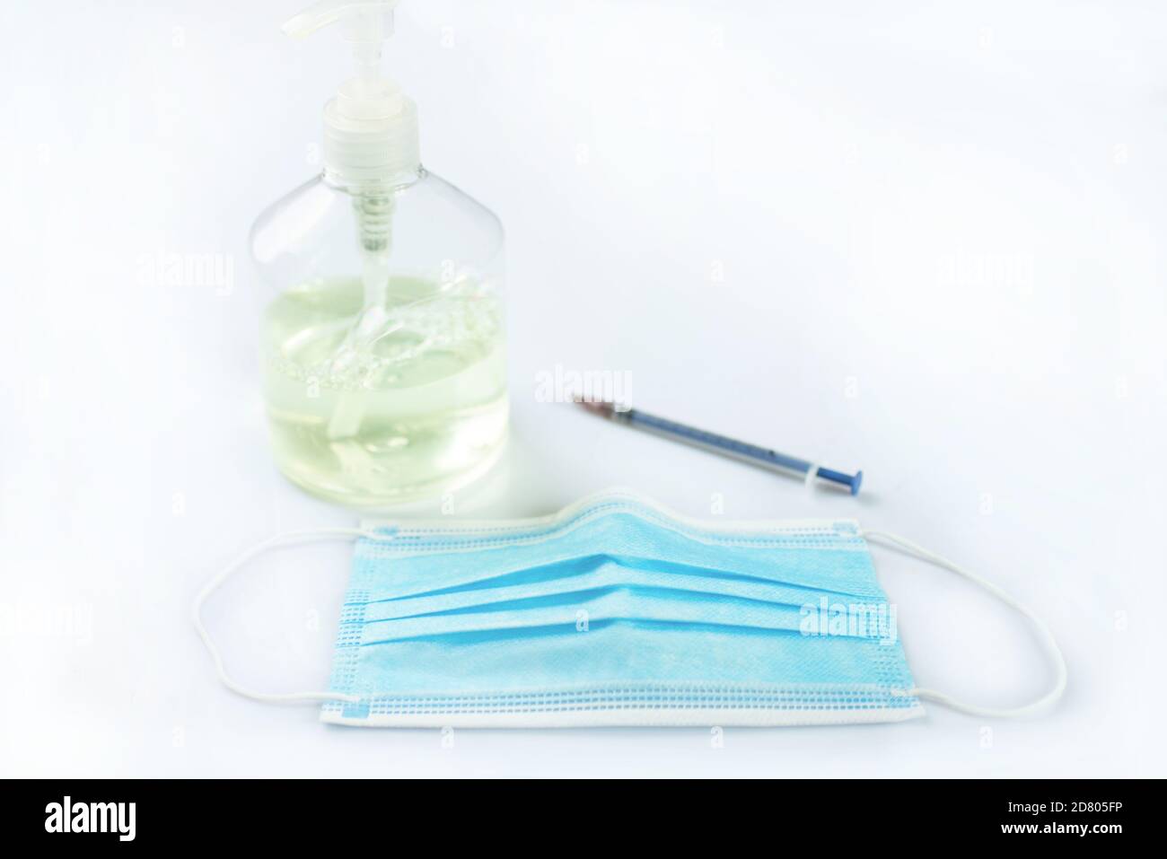 Medical masks, syringes and disinfectants are isolated on a white background Stock Photo