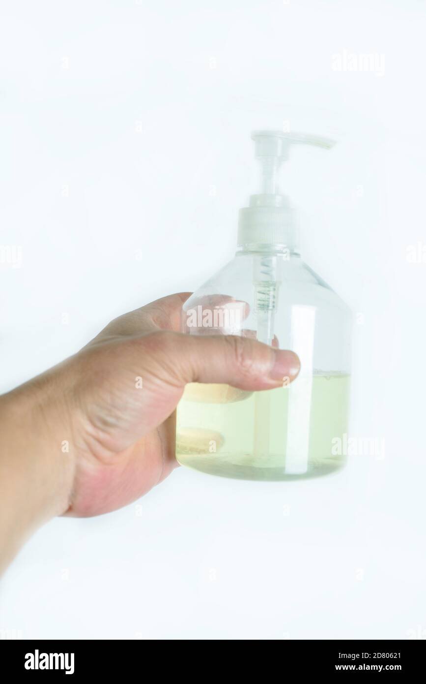 Hand was holding  bottle of hand sanitizer. Stock Photo