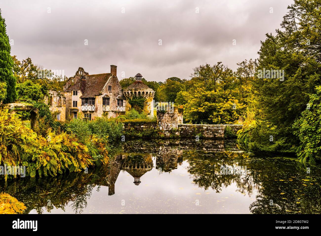 Reflections in the moat of the old castle at Scotney Castle, Kent, UK Stock Photo