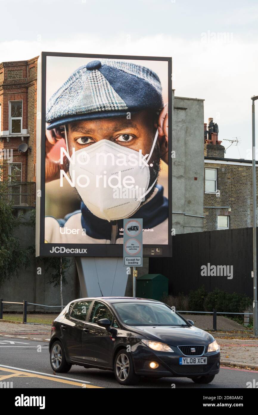 Uber - No Mask, No Ride advert in Wandsworth, southwest London, UK Stock Photo