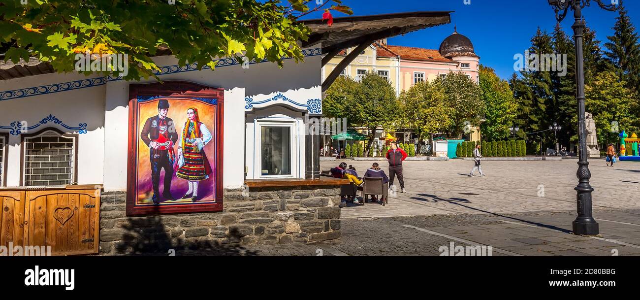Razlog, Bulgaria - October 20, 2020: Downtown street square panoramic view with autumn trees and people panorama Stock Photo