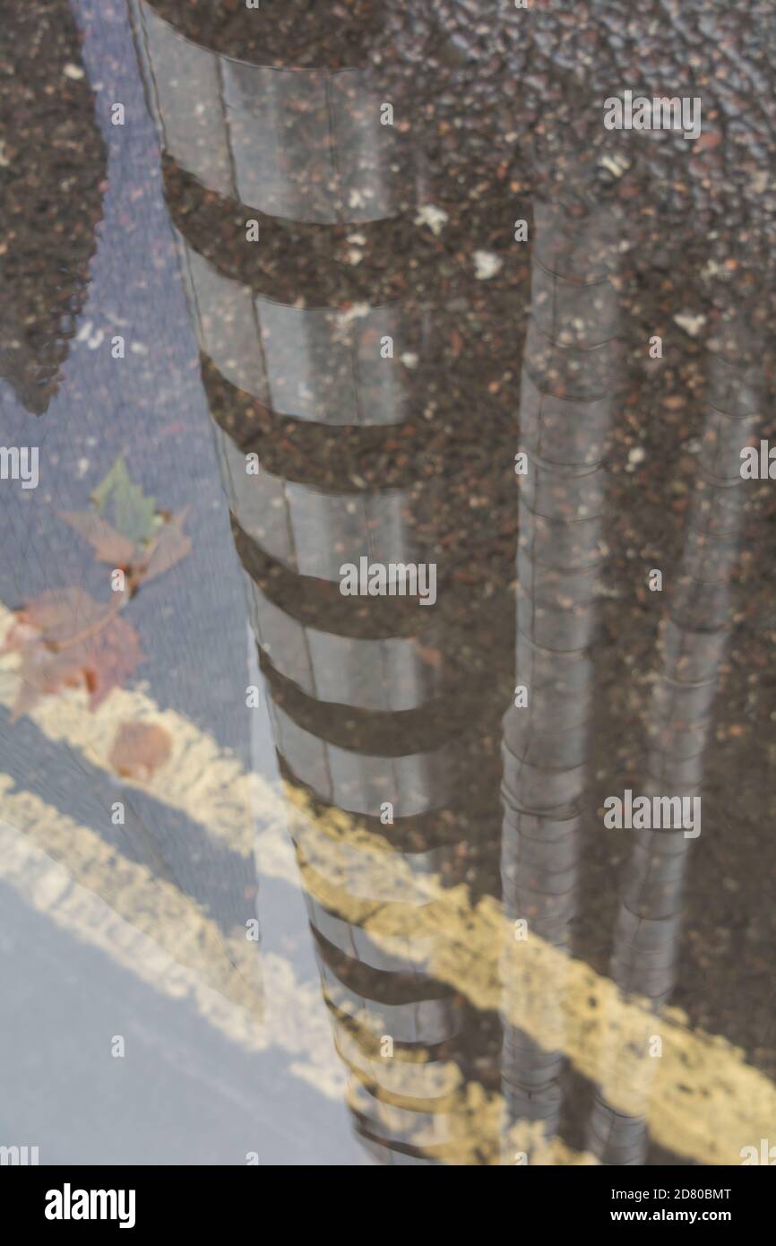 Reflection in a puddle of Lloyd's building, also known as the Inside ...