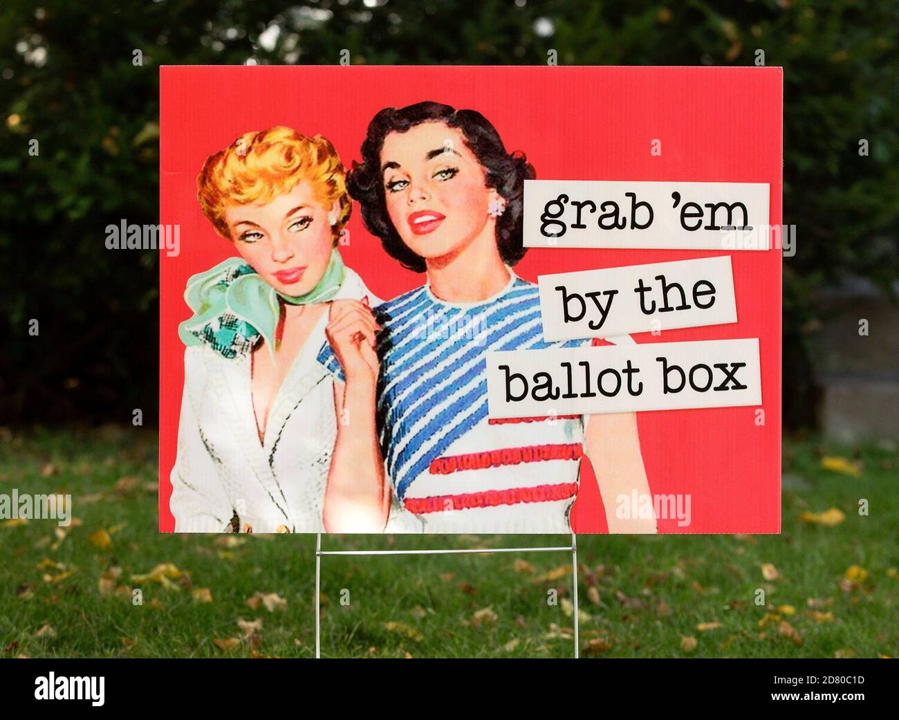 A 2020 retro election yard sign with 2 women with the quote, grab 'em by the ballot bodx.  The sign is a parody on Donald Trump's lewd comment from th Stock Photo