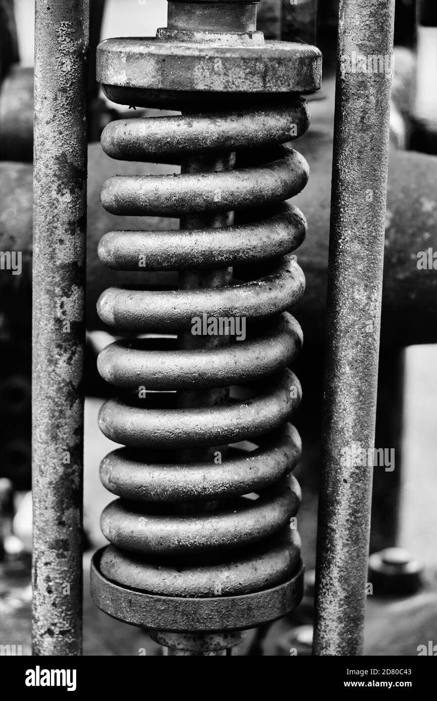 coil spring in one guide, black and white Stock Photo - Alamy