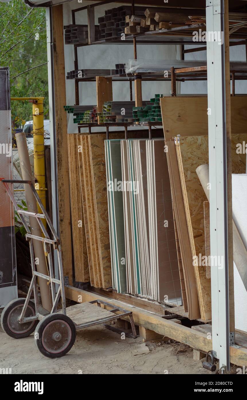 Street warehouse of a small construction store. Various construction ...