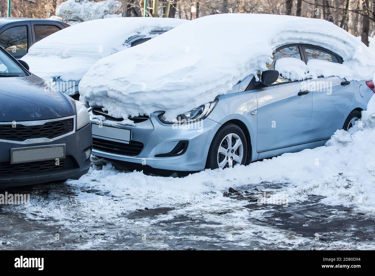 cars in the Parking lot in the winter under the snow Stock Photo - Alamy