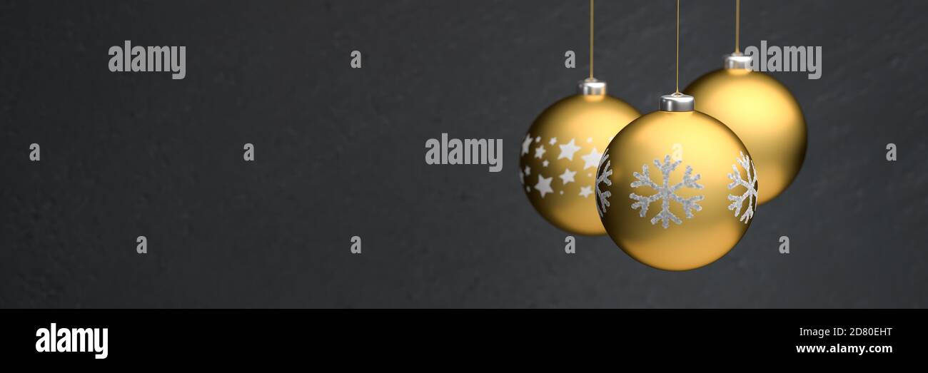 Gold colored christmas baubles with different design hanging in front ...