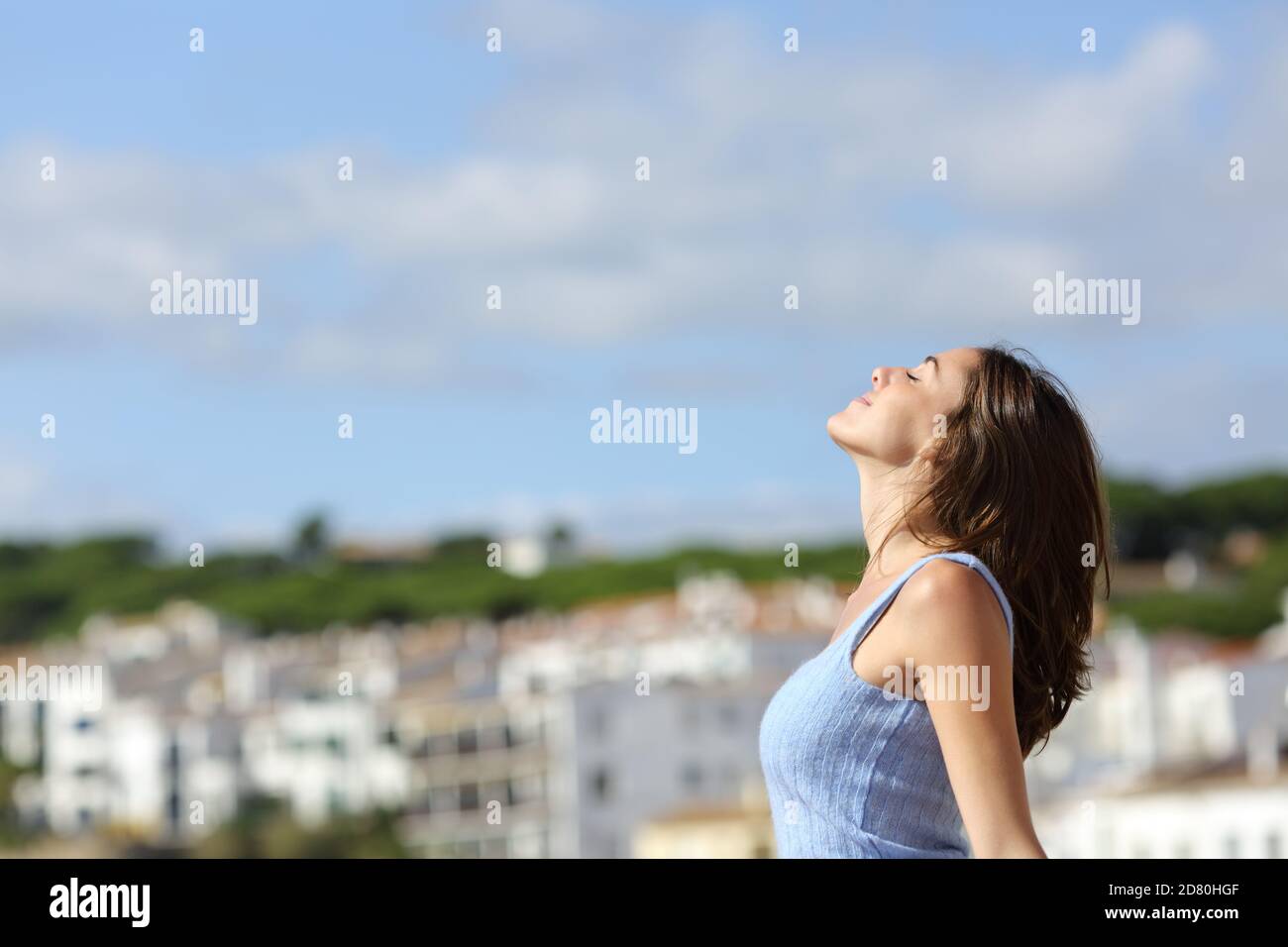 Profila of a relaxed tourist breathing fresh air in a rural town on holiday Stock Photo