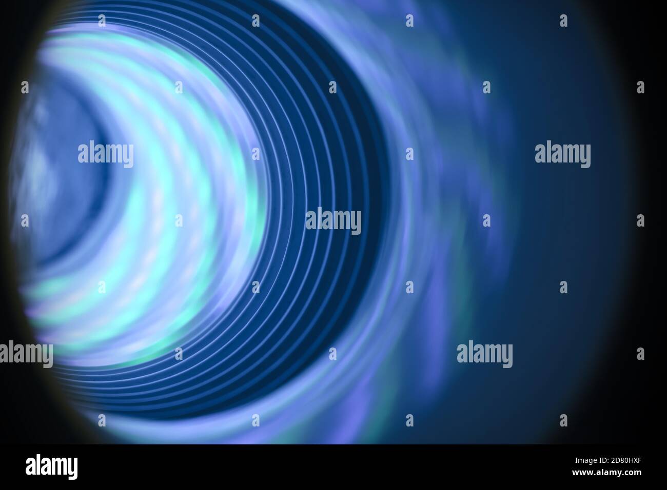Abstract swirl tunnel with silver blue light on a background pattern ...