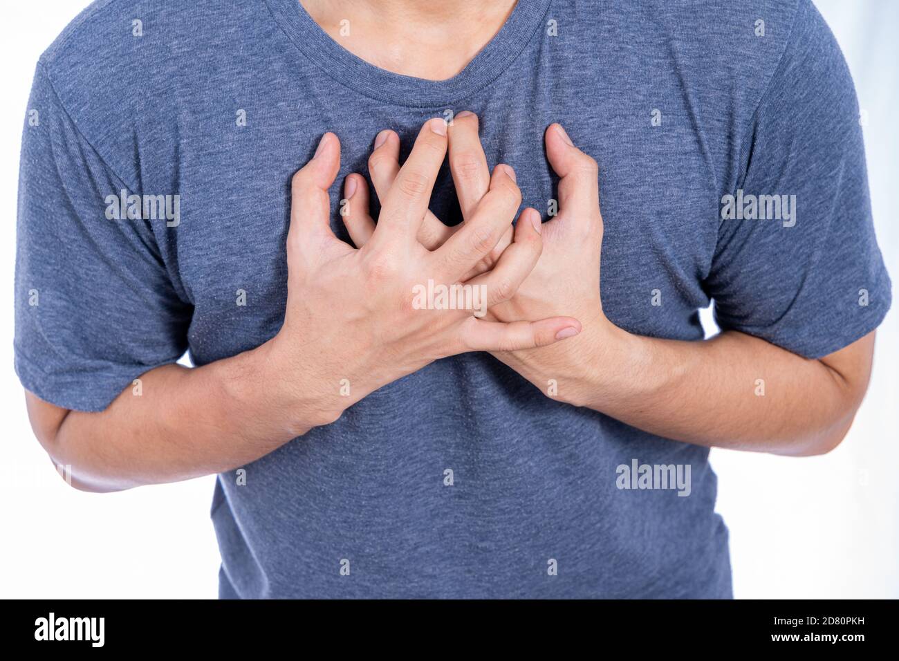 Man touching his heart or chest isolated white background. Healthcare  medical or daily life concept Stock Photo - Alamy