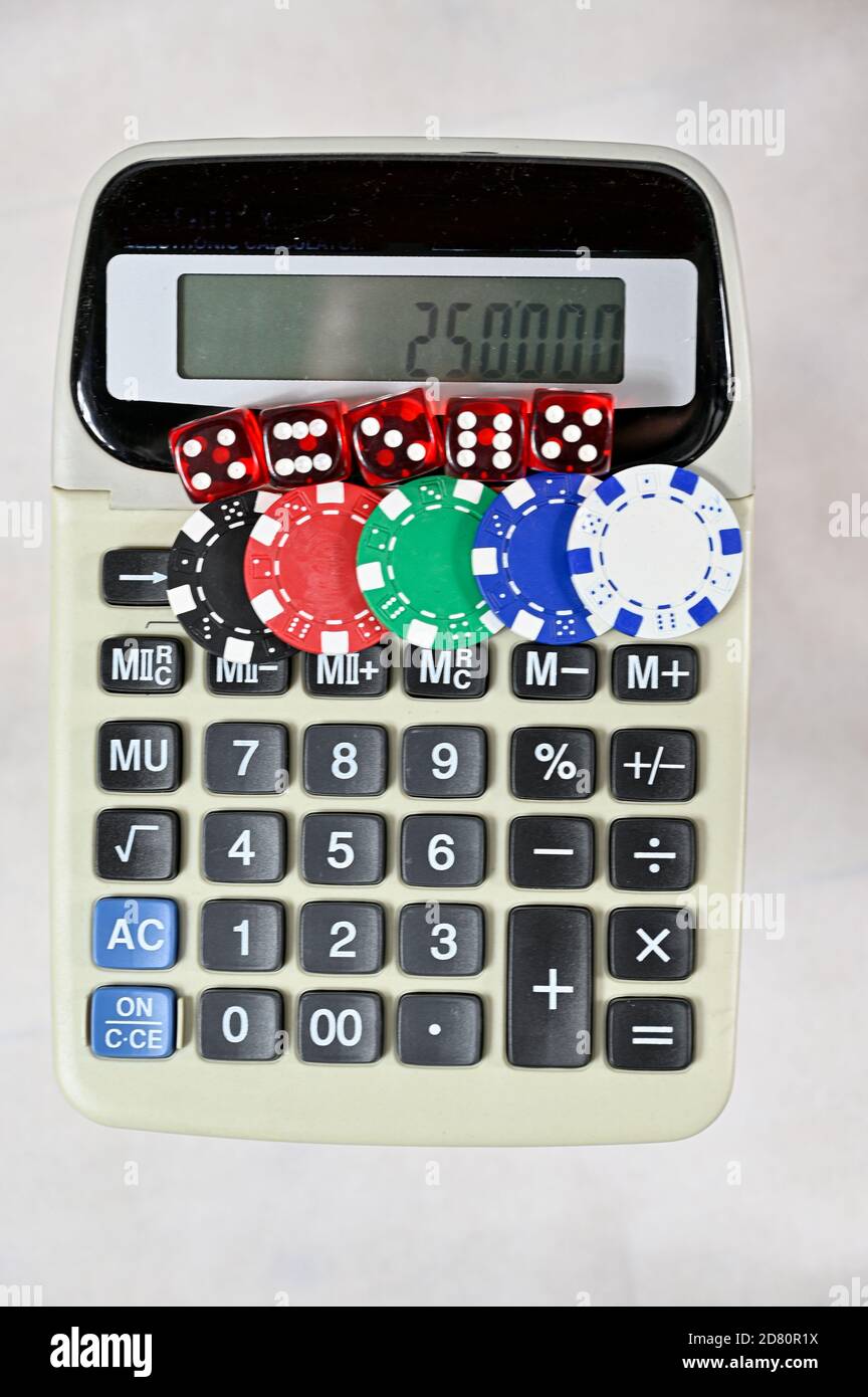 dice and chips on old calculator on white background Stock Photo - Alamy