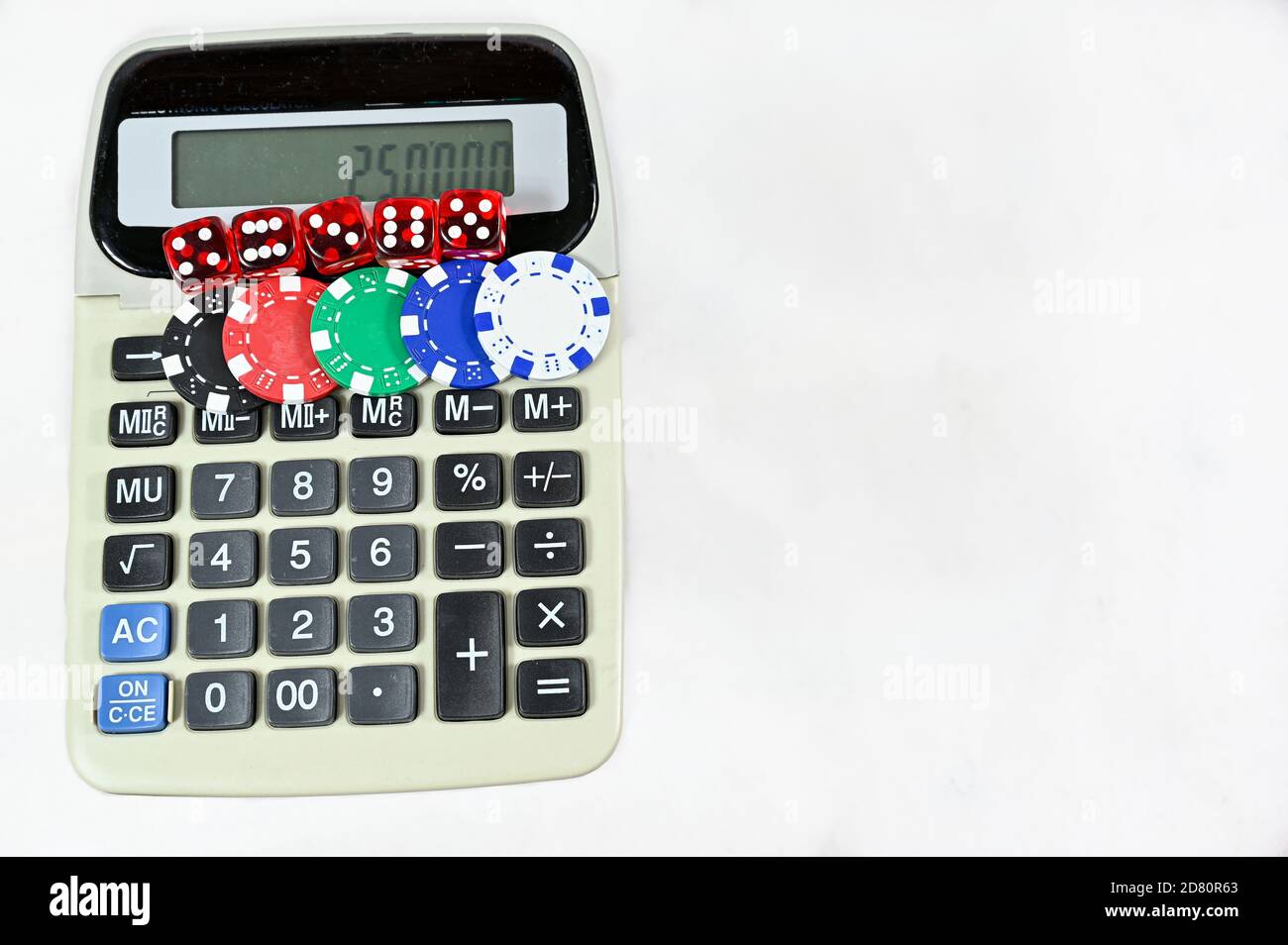 dice and chips on old calculator on white background Stock Photo - Alamy