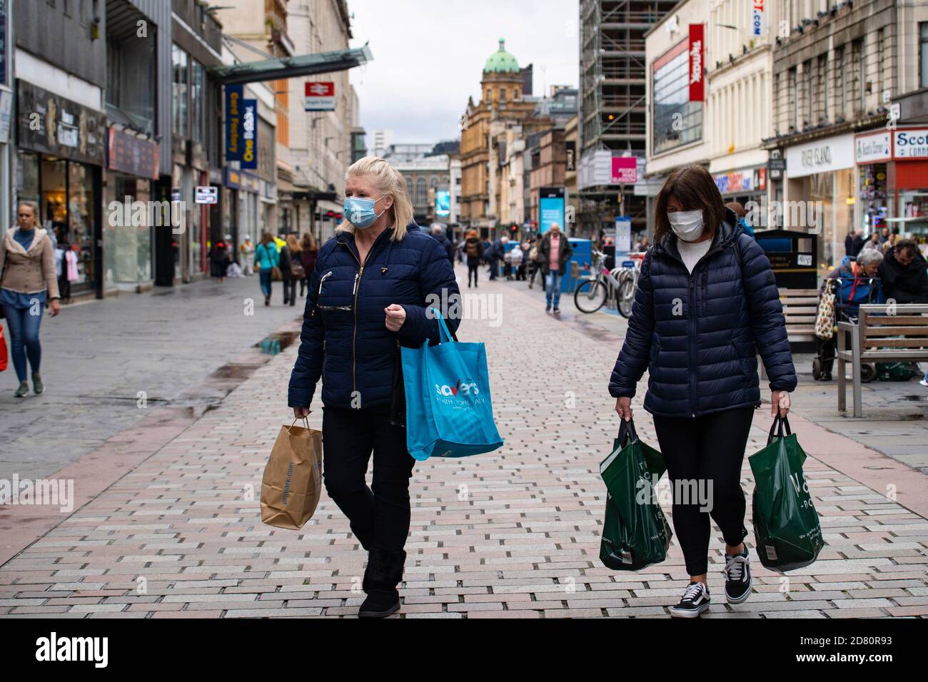 Glasgow, Scotland, UK. 26 October 2020. View of Glasgow city centre on weekday during circuit breaker lockdown with bars and restaurants closed. Pictured; Shoppers wearing facemasks on Argyle Street. . Iain Masterton/Alamy Live News Stock Photo