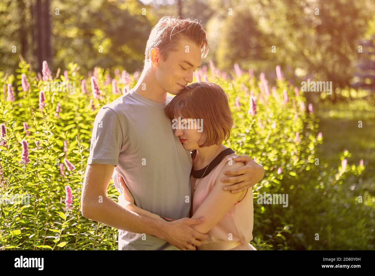 Man hugs woman hi-res stock photography and images - Alamy