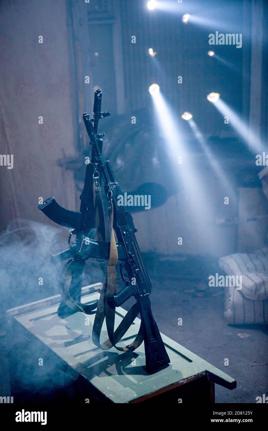 The gun is placed in a dilapidated room Stock Photo - Alamy