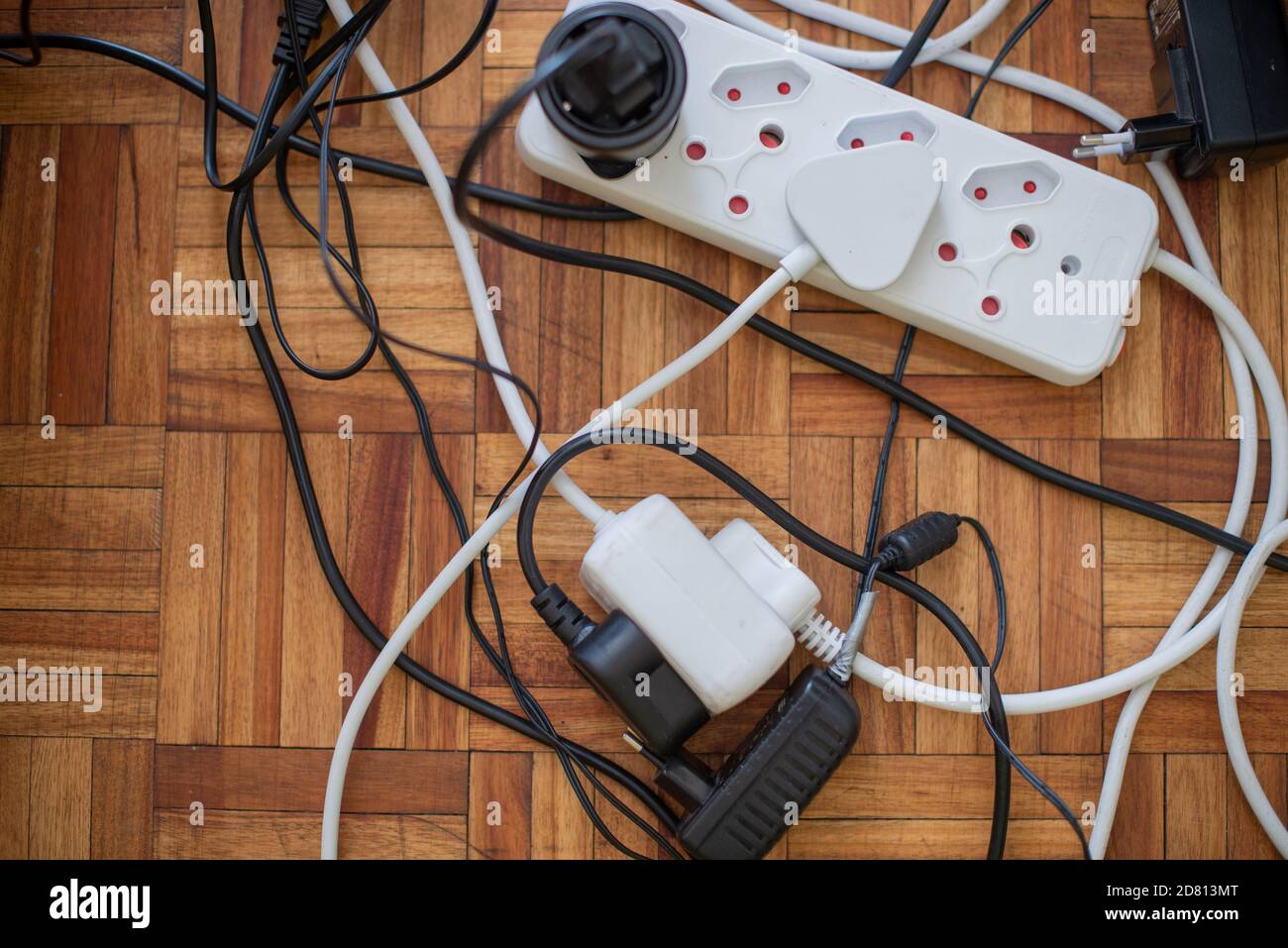 Close up shot of collection of plugs attached to lead Stock Photo