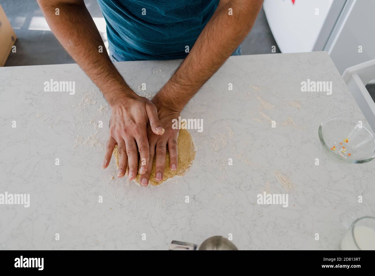Baker pouring flour on dough hi-res stock photography and images - Alamy