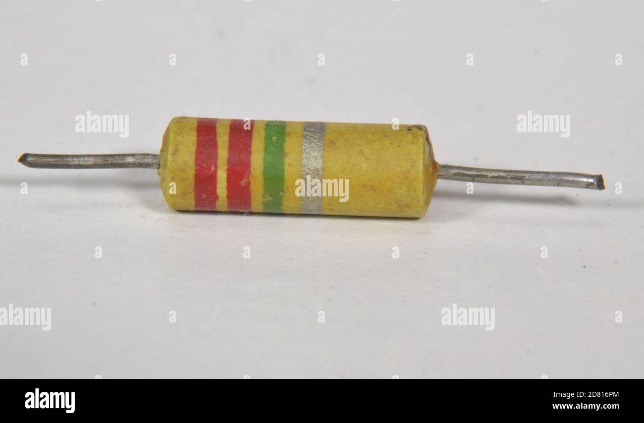 Closeup on single electronic resistor. Color bands tell us that the
